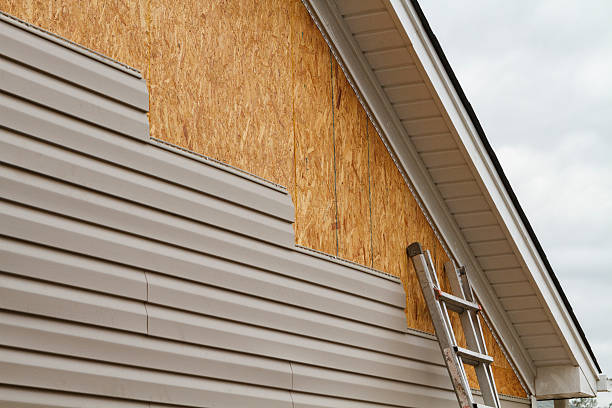 Professional Siding Installation technician working in Island Lake, IL
